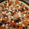 Acropolis -
*A Mediteranian delight! Olive oil and spice blend sauce, garlic chicken, Roma tomatoes, kalamata olives, minced garlic, red onions & feta cheese 
